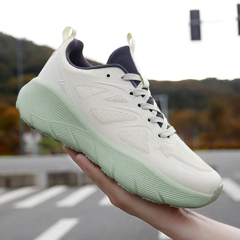 Breathable white mesh athletic sneakers with mint green outsole, ideal for running, walking, and everyday activewear.
