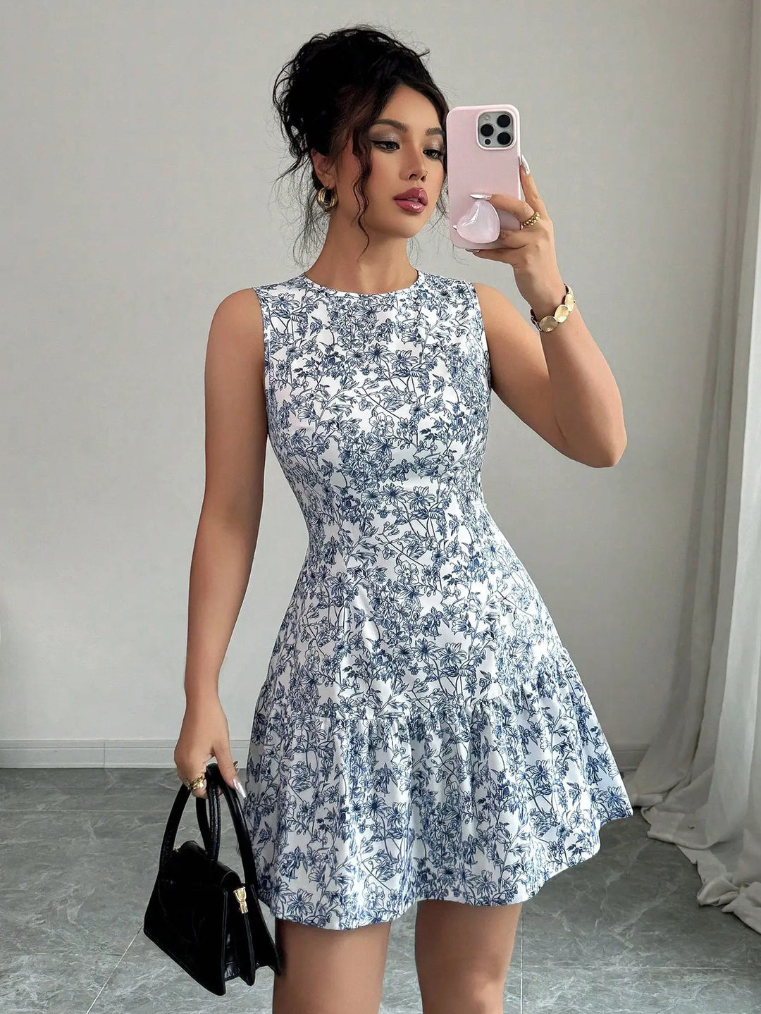 Women’s blue and white floral sleeveless mini dress with tiered skirt – elegant summer brunch outfit