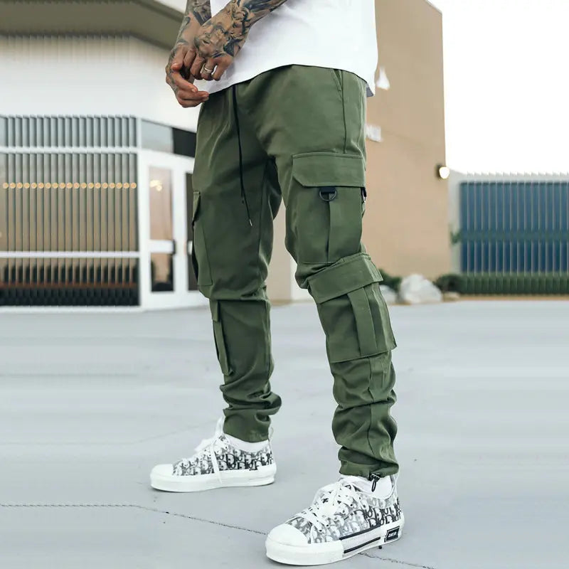 Olive green urban cargo pants for men with multiple zipper pockets – street style
