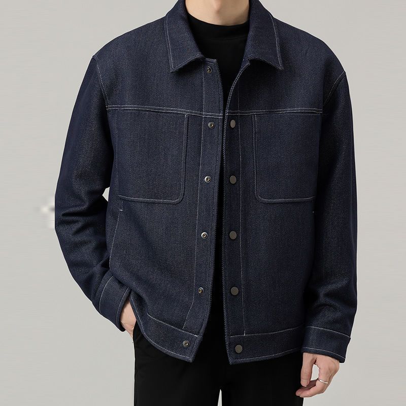Men’s dark blue classic denim jacket with clean stitched detailing – minimalist casual outerwear for modern everyday looks.