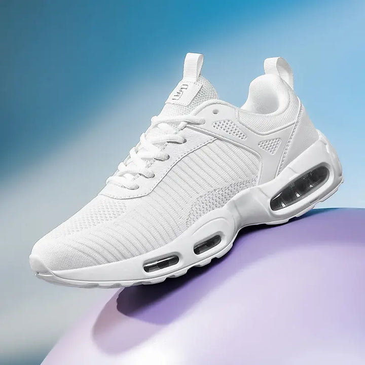 White sneaker with air cushion sole on a gradient blue and purple background