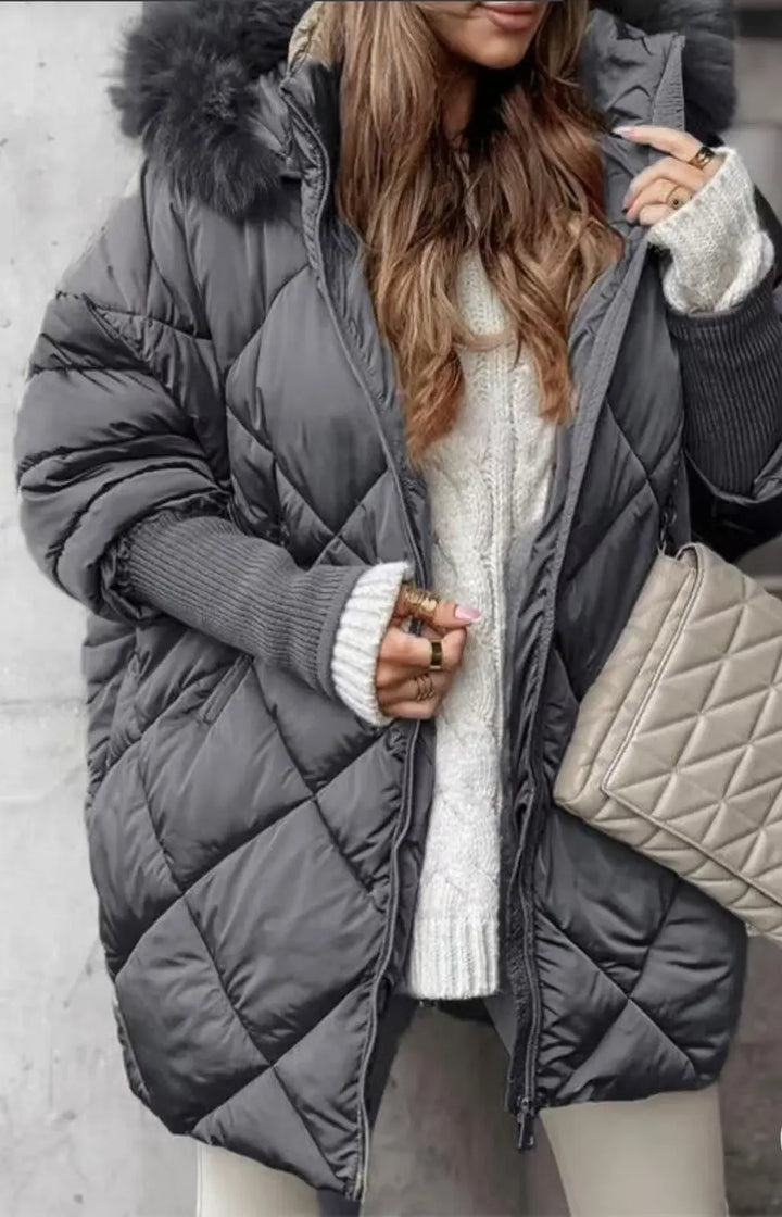 Charcoal gray quilted puffer jacket with luxurious fur trim – chic and comfortable outerwear