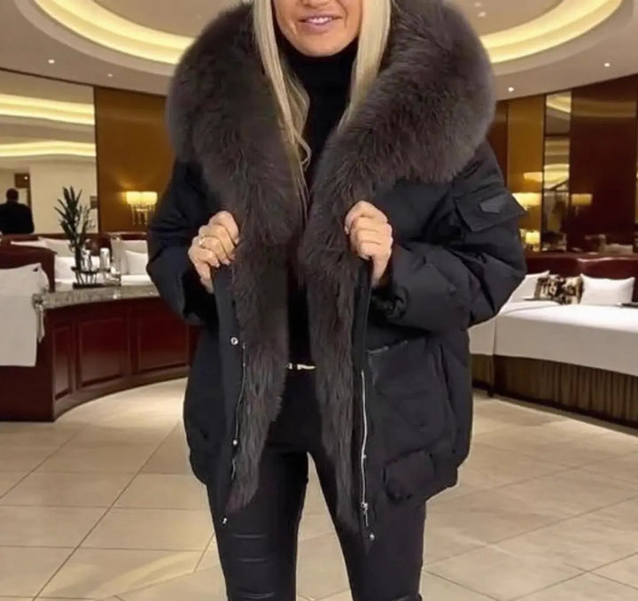 Black fur-lined women's parka jacket for winter – stylish outerwear with oversized faux fur hood