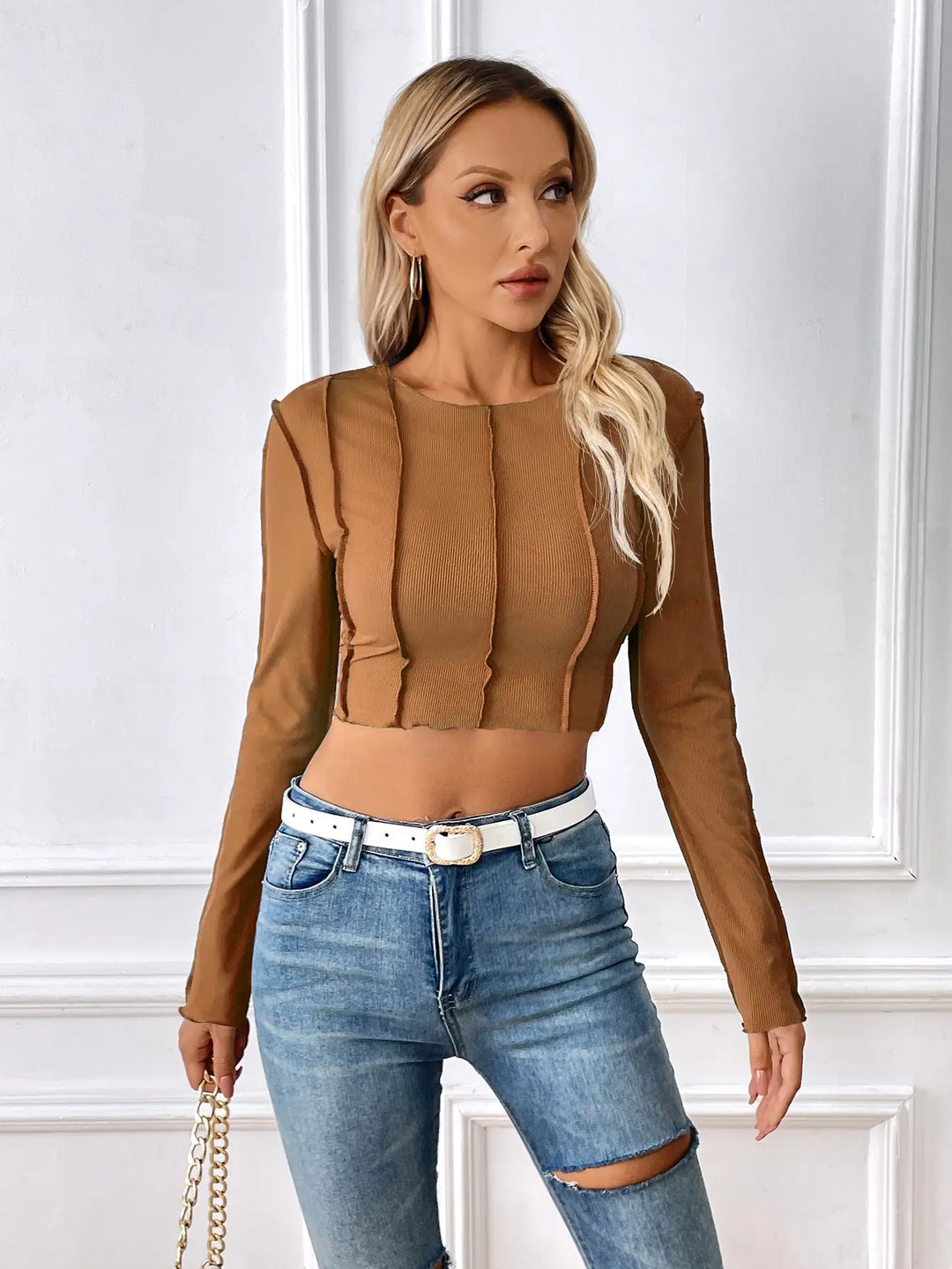 Trendy brown long sleeve crop top for women with vertical seam detailing, ideal for casual streetwear or going out.