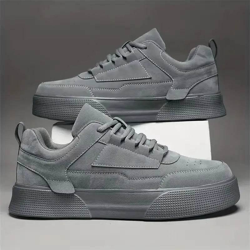 A pair of gray UrbanEase casual shoes with lace-up closure, designed for men.