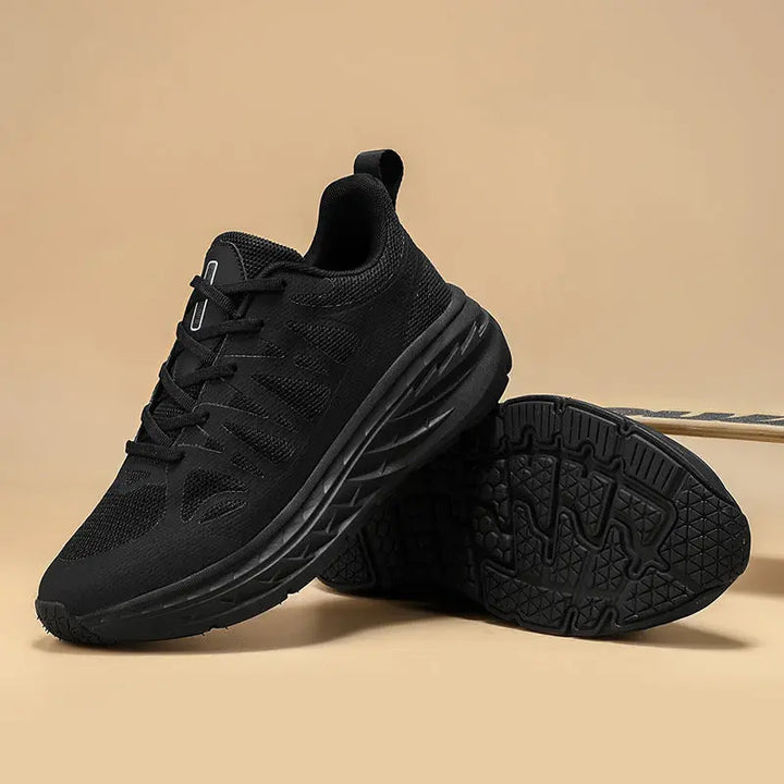 A pair of black PureFit Sports Shoes