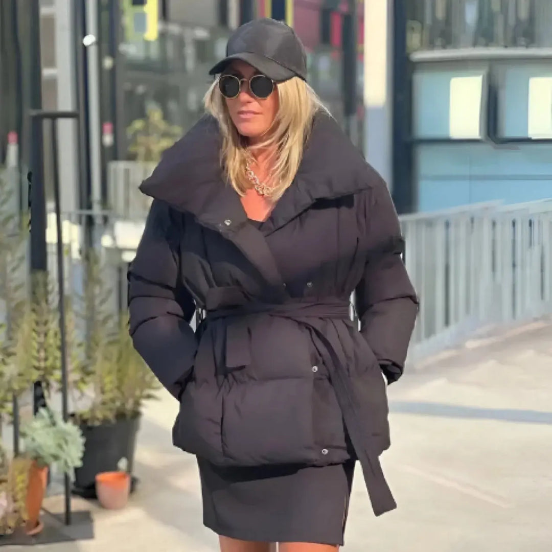 Black oversized puffer jacket with tie belt – trendy and warm women’s outerwear.