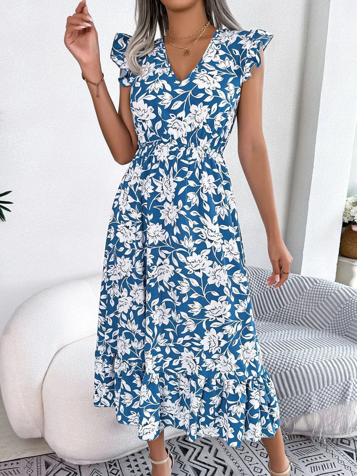 Women’s blue floral midi dress with white flower print, flutter sleeves, V-neckline, and ruffle hem – elegant summer outfit
