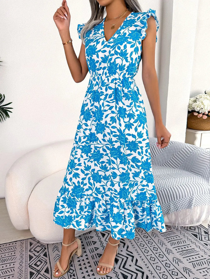 Women’s blue floral midi dress with white flower print, flutter sleeves, V-neckline, and ruffle hem – elegant summer outfit