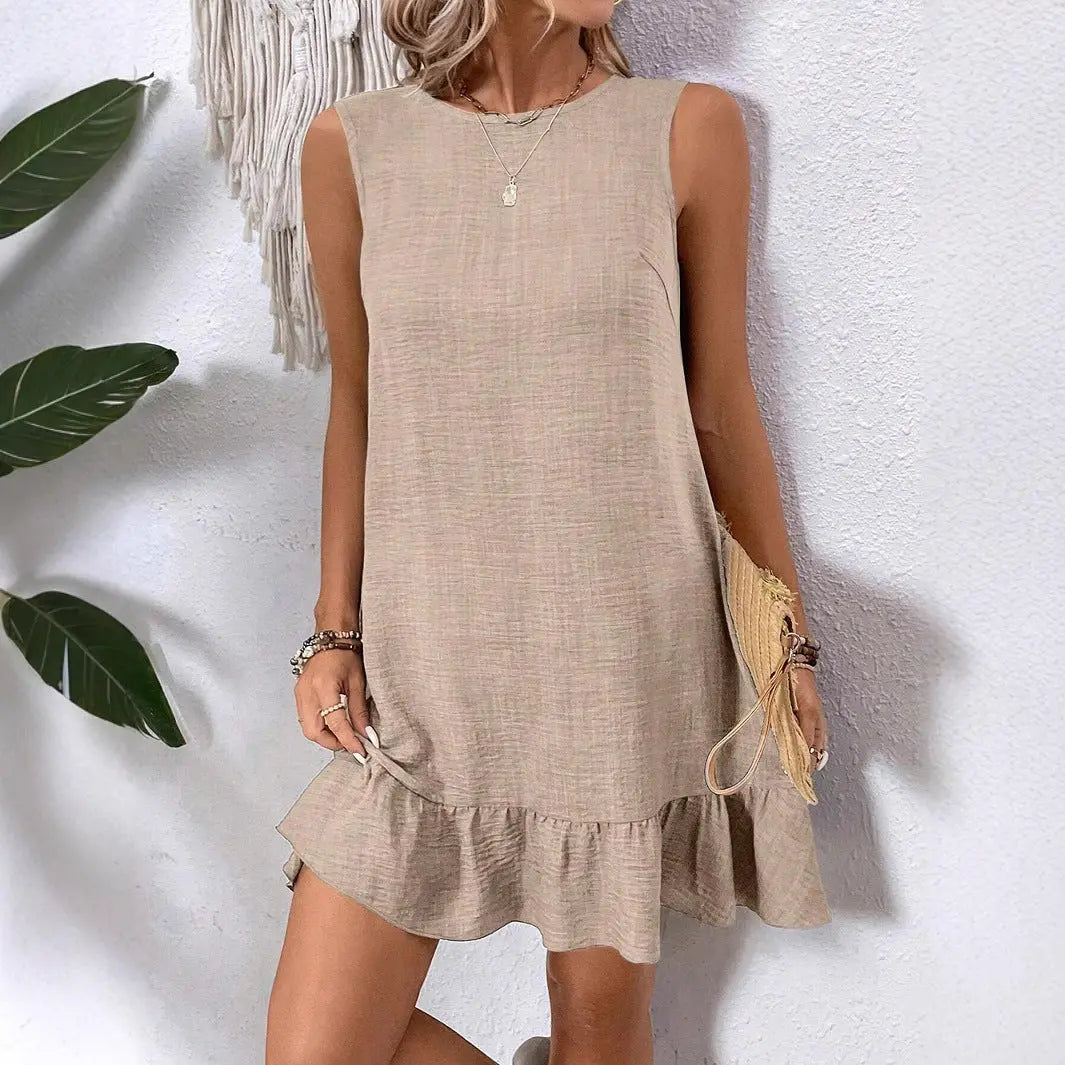 Minimalist beige sleeveless mini dress with soft texture and playful ruffled hem – perfect for sunny days and beachwear
