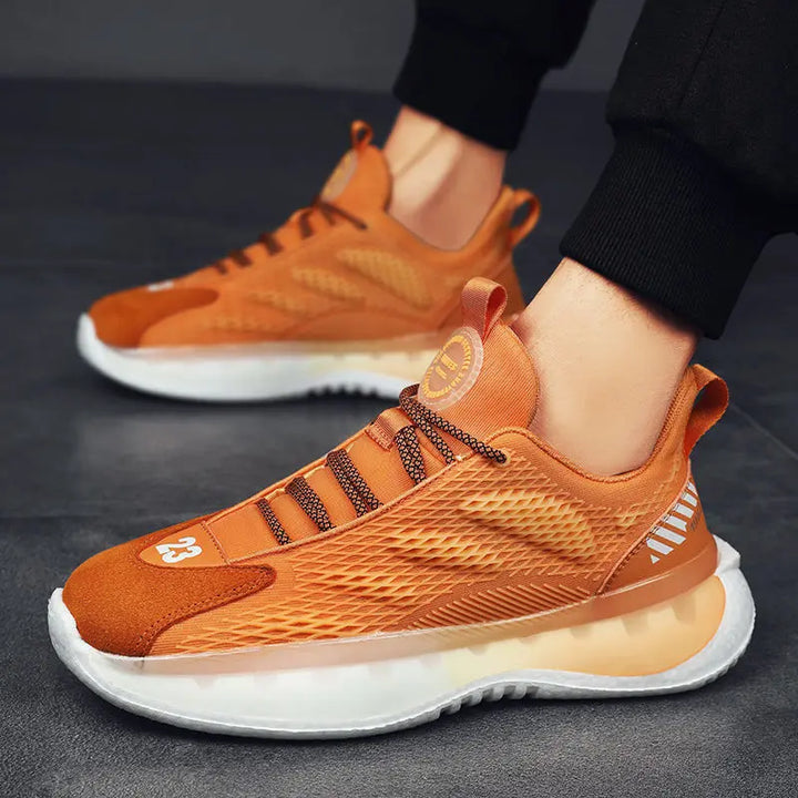 A pair of SleekMotion Running Sneakers with a orange and white color scheme, showcasing the mesh upper and cushioning sole.
