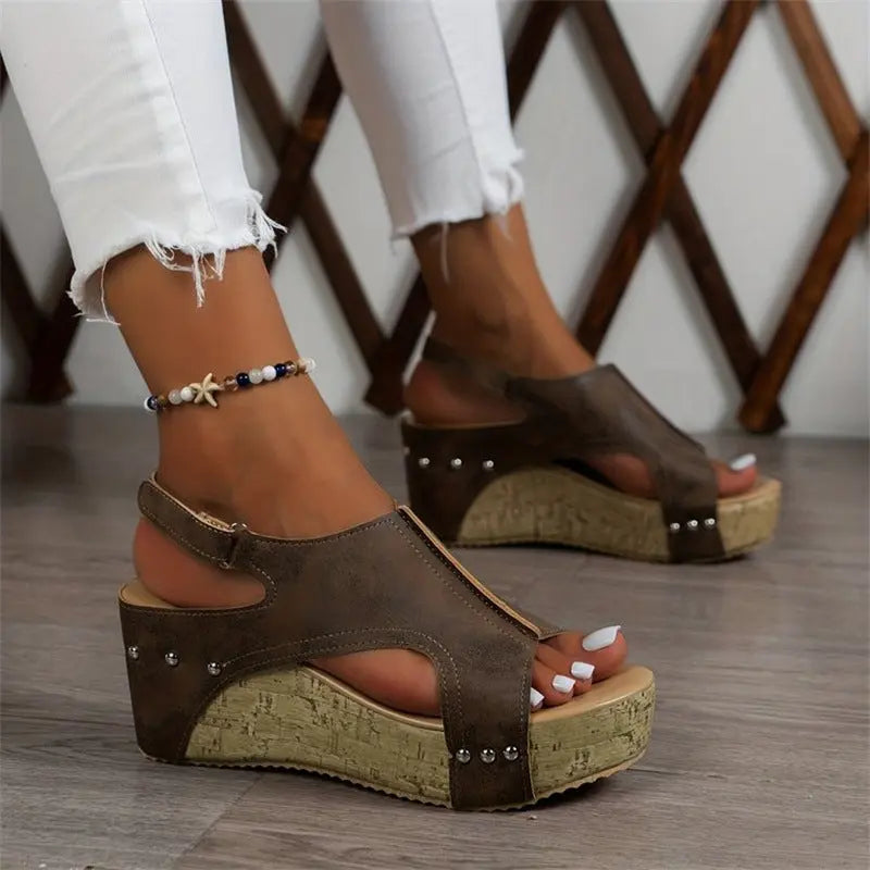 Women’s brown wedge sandals with cork platform sole, peep toe, ankle strap, and stud accents – casual summer footwear