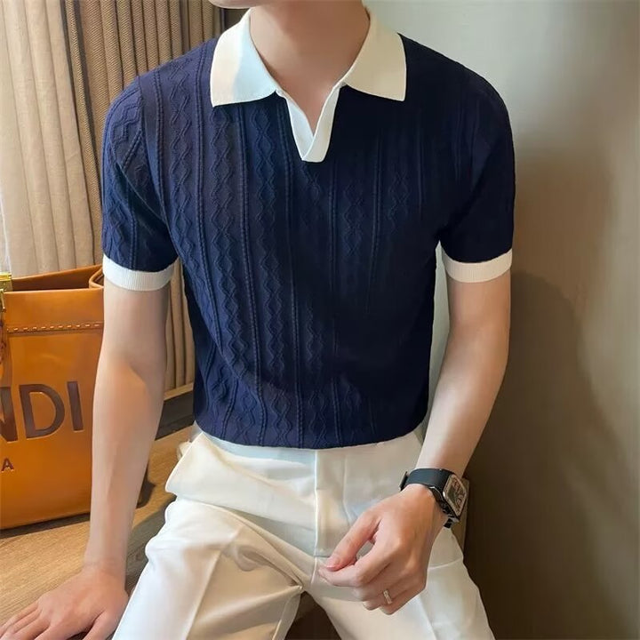 Stylish navy blue knit polo shirt for men with crisp white collar – elevated casual wear ideal for smart summer styling