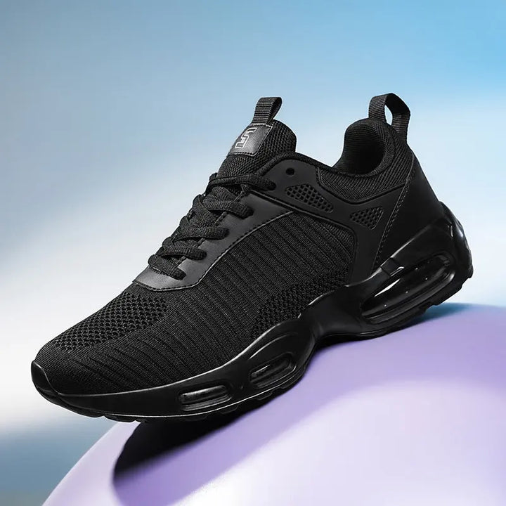 Black sneaker on a gradient blue and purple background