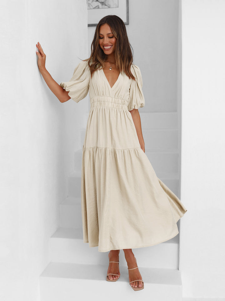 Cream V-neck midi dress – lightweight and breathable women’s dress ideal for beach outings or garden events.
