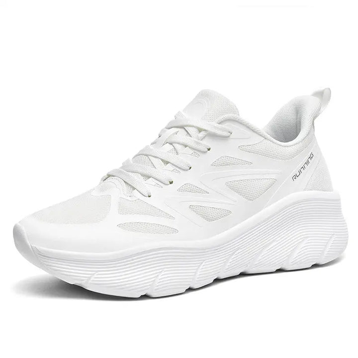 A pair of white ActiveGlide Sports Shoes placed on a pedestal, showcasing the sole design