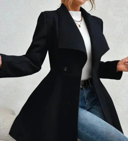 Sleek black women’s winter coat with wide lapels and buttoned closure – perfect blend of sophistication and warmth