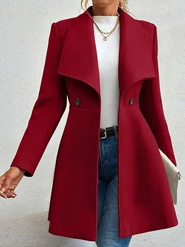 Deep red formal long coat for women with wide lapel and double-breasted closure – statement piece for cold weather fashion.