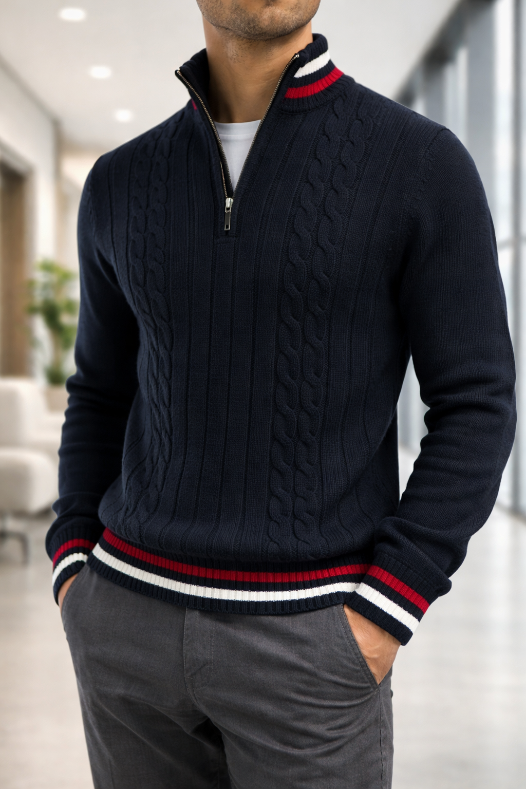 Man wearing a navy cable knit sweater